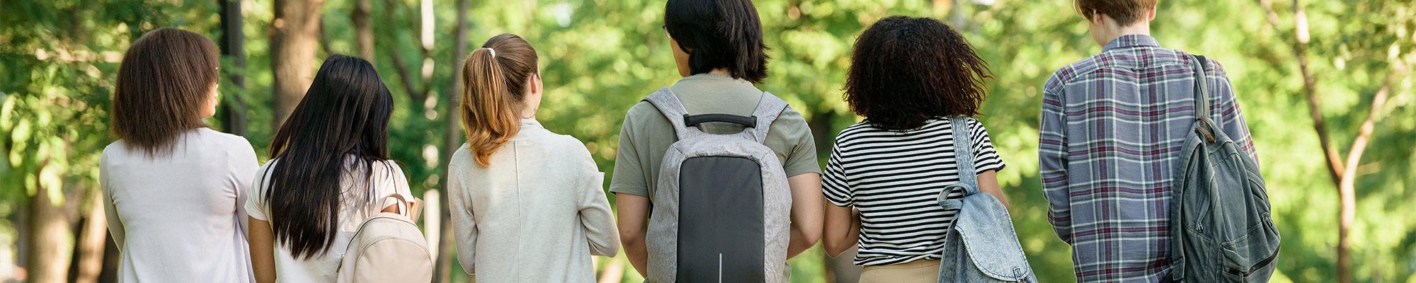 Stuents walking with books and backpacks